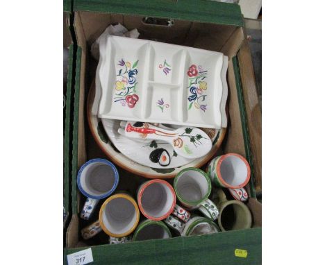 A collection of pottery mugs, a Poole pottery dish and other items