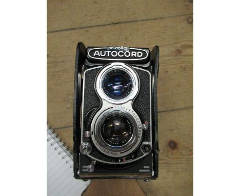 A Minolta camera and various accessories