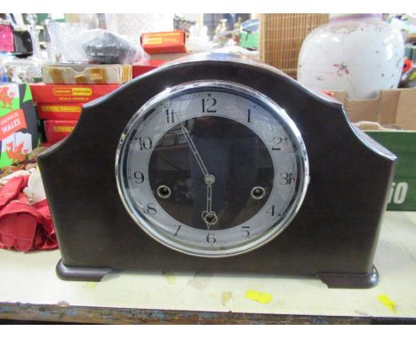 A Bakelite cased mantel clock, together with an barometer
