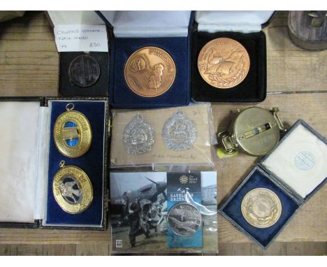 A collection of Military items, to include a Churchill medal, cap badges, compass etc