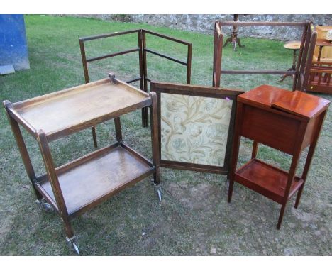 A group of furniture, to include two clothes rails, a tea trolley, a fire screen and a sewing box