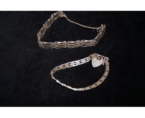 Two silver gate bracelets 