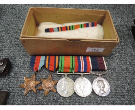 A collection of four World War II medals and a RAF Long Service and Good Conduct medal to 900784 Sgt R P Towers RAF