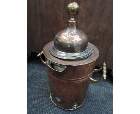 An early 20th century copper samovar having ceramic liner and brass handles and knop