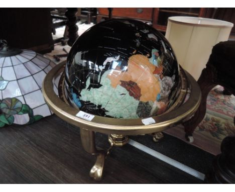 A modern table globe having brass stand and a semi precious world order