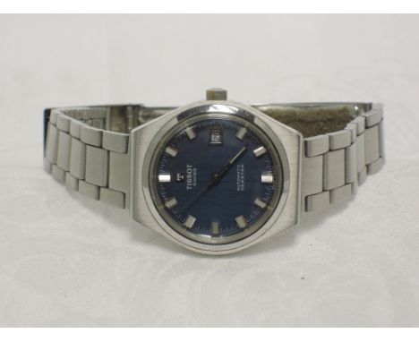 A gents Tissot Seastar automatic wrist watch having a baton numeral dial and date aperture to blue face on a stainless steel 