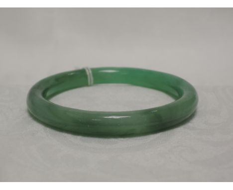 A jade bangle of traditional form