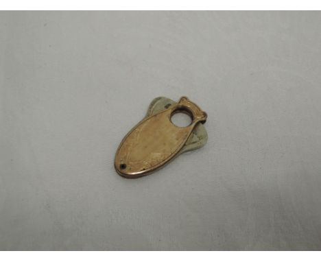 A gold plated cigar cutter  having engine turned and floral engraved decoration (marked Patd Mar 28th 1916)