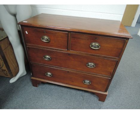 A 19th century mahogany chest of 2 short and 2 long cockbeaded drawers on bracket feet