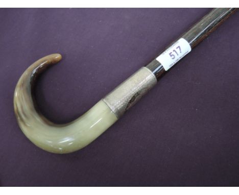 A vintage walking stick having HM silver collar, monogrammed EB, 31/12/23 with horn handle on coromandel shaft