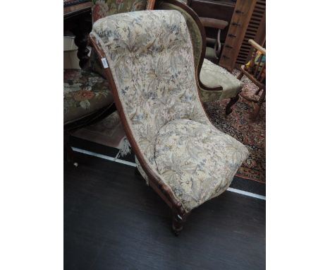 A Victorian rosewood frame salon chair having later tapestry upholstery on turned legs