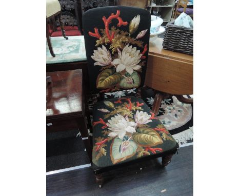 A Victorian mahogany chair having floral woolwork tapestry on twist frame