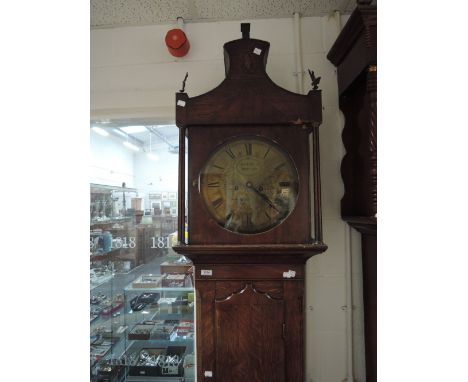 A late 18th century oak longcase clock having finial hood containing brass circular dial and 8 day movement by Geo LeFever, W