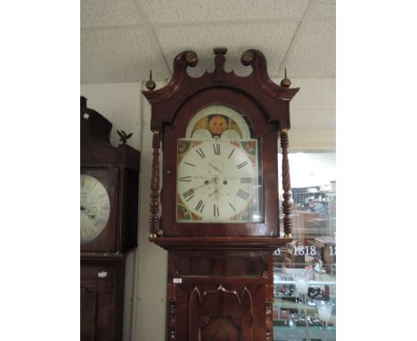 An early 19th century mahogany longcase clock having swan neck hood containing arched painted moonphase dial and 8 day moveme