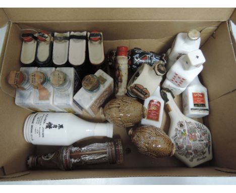 A mainly ceramic miniature spirits, mainly sealed but some have evaporated 