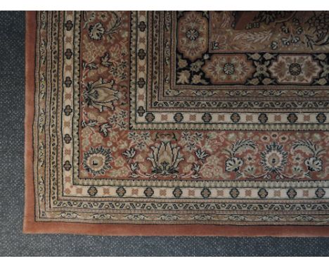 A classic carpet square of traditional Belgium design on salmon colour ground