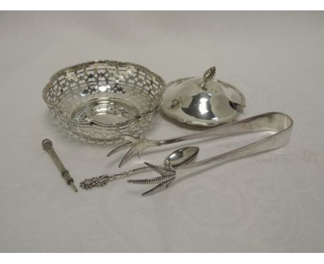 A small selection of HM silver and plated items including a pair of sugar nips, silver lid, propelling pencil, pierced trinke