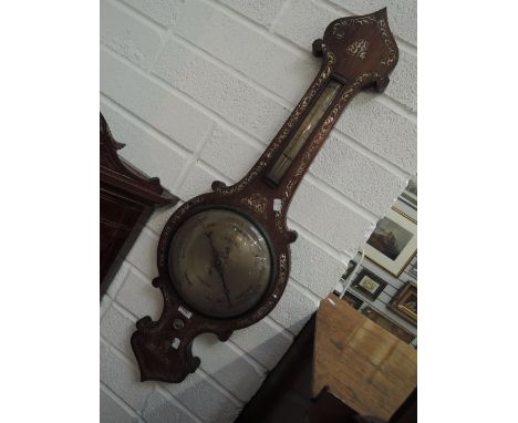 An early 19th century rosewood frame barometer having mother of pearl inlay decoration with thermometer scale and silvered di