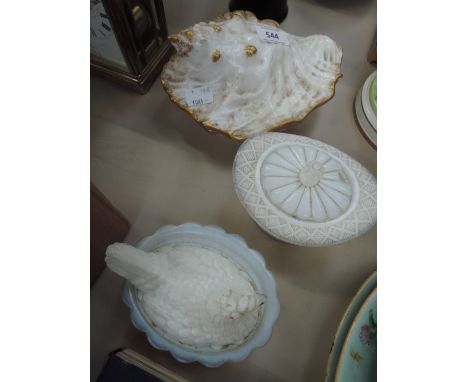 A 19th century porcelain dish modelled as a shell, a Victorian opaque glass trinket modelled as a top hat and an opaque glass