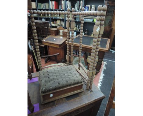 An early 20th century oak footstool, stamped Gillows, Lancaster and a similar period bleached folding fire screen