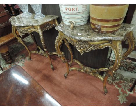 A pair of late 20th century Italian style demi lune console tables having mottled brown marble tops on scroll gilt wood frame