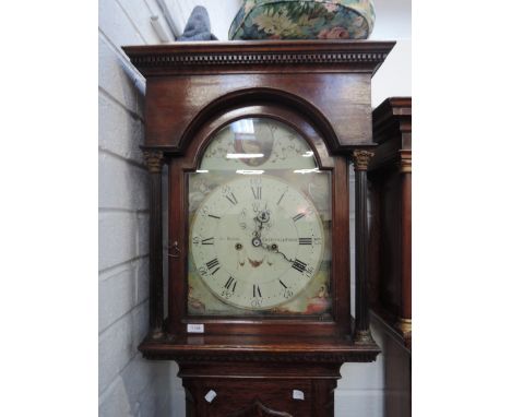 A late 18th century oak longcase clock having arch and corinthian pillar hood containing painted arch dial and an 8 day movem