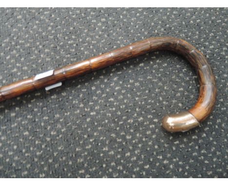 A vintage mahogany walking stick having 9ct gold knop