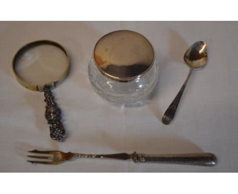 Silver teaspoon, silver handled pickle fork, silver handled magnifying glass and a silver topped vanity pot