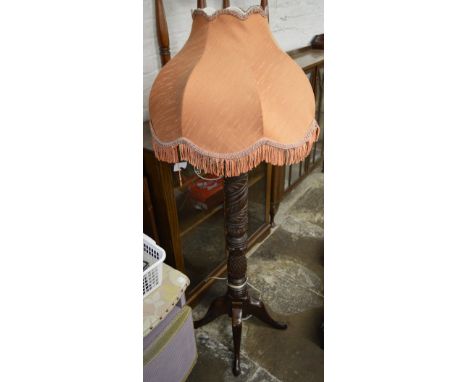 Standard lamp converted from a bedpost