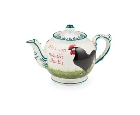 A WEMYSS WARE TEAPOT 'BLACK COCKERELS AND HENS' PATTERN, EARLY 20TH CENTURY inscribed in red ' Maduinn mhaith dhuibh', faintl