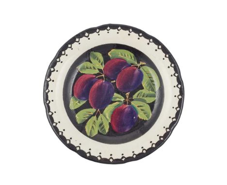 A WEMYSS WARE GORDON DESSERT PLATE 'PLUMS' PATTERN, CIRCA 1900 impressed WEMYSS, black painted WemyssDimensions:21cm diameter