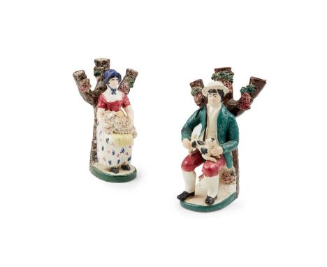 TWO SCOTTISH EAST COAST POTTERY  FIGURAL SPILL VASES PORTOBELLO, MID-19TH CENTURY  one modelled as a shepherd seated with a d