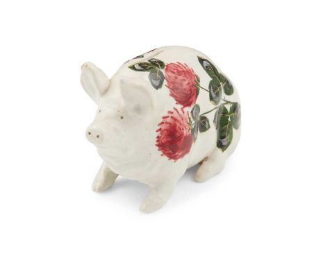 A WEMYSS WARE MONEY BOX PIG 'CLOVER' PATTERN, CIRCA 1900 painted by James Sharpe, impressed WEMYSS, yellow painted WemyssDime