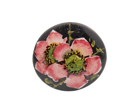 A WEMYSS WARE HAT PIN CIRCA 1900 painted with two dog roses on a black ground, impressed WEMYSSDimensions:5.1cm diameter