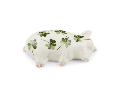 A WEMYSS WARE SLEEPING PIGLET 'SHAMROCKS' PATTERN, CIRCA 1900 impressed WEMYSSDimensions:16cm long
