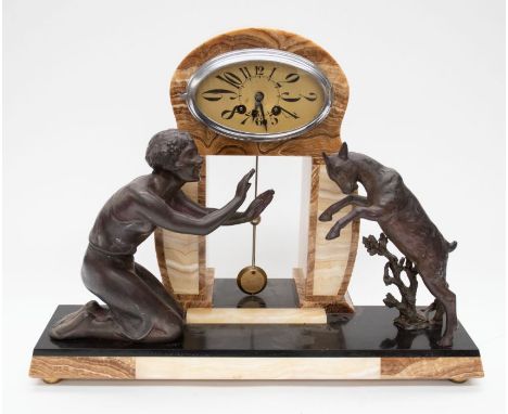A large 1930's Art Deco marble mantle clock with lady and goat detailing, oval face, Arabic numerals