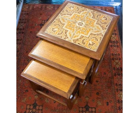 G-Plan - A nest of three tables with designed tile top to largest, largest approx. 50cm wide x 50.5cm high.&nbsp;