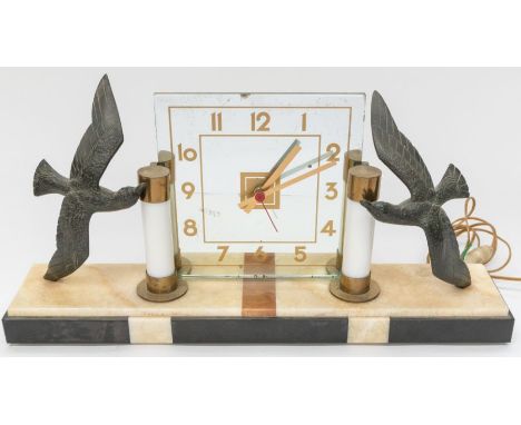 A 1930's Art Deco mantle clock with square mirrored face, marble base lamp, seagull detail to each side