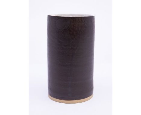 Dame Lucie Rie (1902-1995)Stoneware vase of cylindrical form with manganese glaze to the exterior and white glaze to the inne