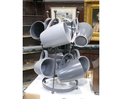 Metal mug tree with grey ceramic mugs