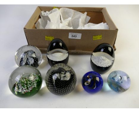 Collection of Caithness paperweights: Eagle and Mountain, Myriad, Cauldron and Moon Crystal.