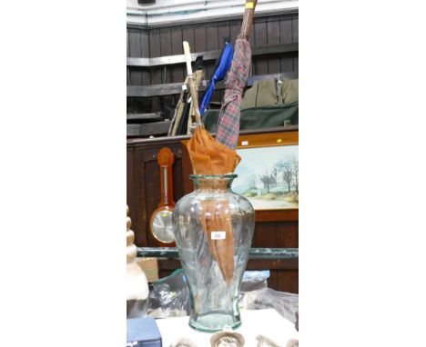 Large glass vase or stick stand with two vintage umbrellas