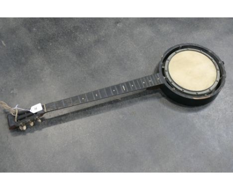 Parts of a vintage wooden banjo