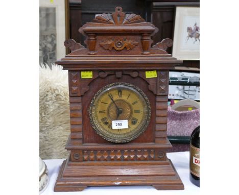 Ornate carved wooden mantel clock