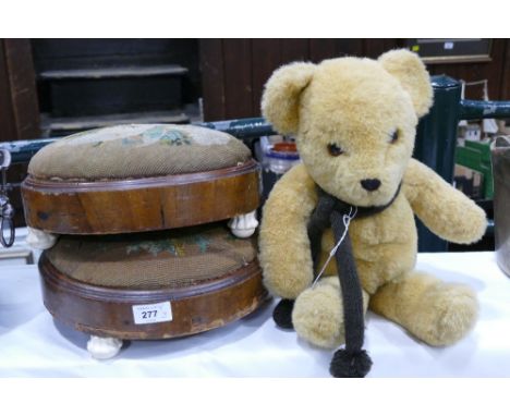 Two low tapestry topped footstools with porcelain feet and vintage Teddy Bear