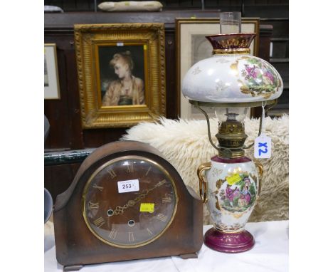 Wooden mantel clock and a Fragonard patterned oil lamp