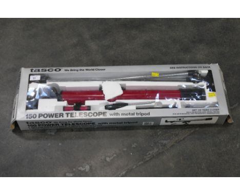 A Tasco 150 power telescope with metal tripod in box