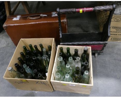 Magazine rack, vintage suitcase and two boxes of vintage brewery bottles