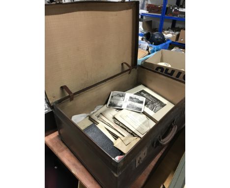 A VINTAGE SUITCASE AND CONTENTS