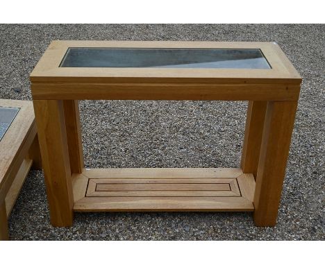 A modern light oak console table with inset glass top and open undertier (to match previous lot), 110 cm wide x 45 cm deep x 